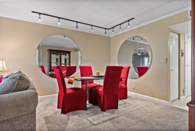 Relaxing is easy from this ideally located golf course condo in on Isla Del Sol Yacht and Country Club in Florida - for sale on GolfHomes.com, golf home, golf lot