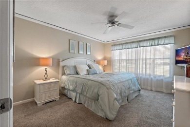 Relaxing is easy from this ideally located golf course condo in on Isla Del Sol Yacht and Country Club in Florida - for sale on GolfHomes.com, golf home, golf lot