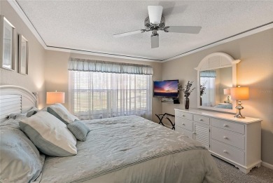 Relaxing is easy from this ideally located golf course condo in on Isla Del Sol Yacht and Country Club in Florida - for sale on GolfHomes.com, golf home, golf lot