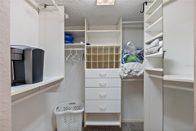 Relaxing is easy from this ideally located golf course condo in on Isla Del Sol Yacht and Country Club in Florida - for sale on GolfHomes.com, golf home, golf lot
