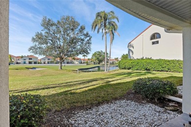 Relaxing is easy from this ideally located golf course condo in on Isla Del Sol Yacht and Country Club in Florida - for sale on GolfHomes.com, golf home, golf lot