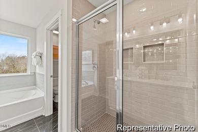 This semi-custom home in Lake Royale offers 3BR/2.5BA and Quick on River Golf and Country Club at Lake Royale in North Carolina - for sale on GolfHomes.com, golf home, golf lot