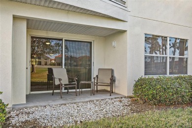 Relaxing is easy from this ideally located golf course condo in on Isla Del Sol Yacht and Country Club in Florida - for sale on GolfHomes.com, golf home, golf lot