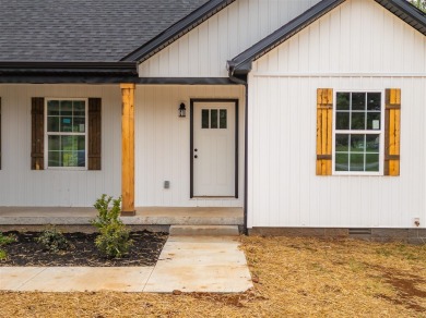 This beautiful home offers a relaxed and stylish lifestyle in a on Russellville Country Club in Kentucky - for sale on GolfHomes.com, golf home, golf lot