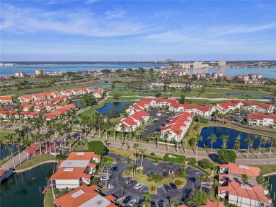 Relaxing is easy from this ideally located golf course condo in on Isla Del Sol Yacht and Country Club in Florida - for sale on GolfHomes.com, golf home, golf lot