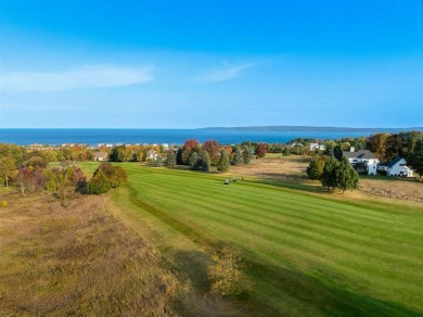 Welcome to this exquisite 4-bedroom, 4-bath home nestled in the on Crooked Tree Golf Club in Michigan - for sale on GolfHomes.com, golf home, golf lot