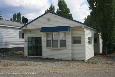Spacious 1998 nomad park model, 584 square feet. Large living on Star Valley RV Golf Course in Wyoming - for sale on GolfHomes.com, golf home, golf lot
