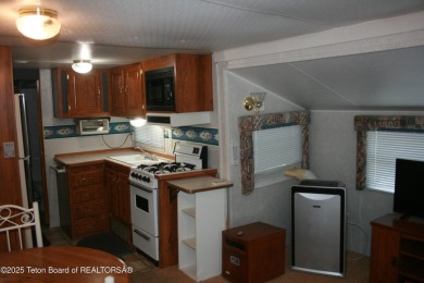Spacious 1998 nomad park model, 584 square feet. Large living on Star Valley RV Golf Course in Wyoming - for sale on GolfHomes.com, golf home, golf lot