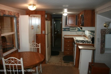 Spacious 1998 nomad park model, 584 square feet. Large living on Star Valley RV Golf Course in Wyoming - for sale on GolfHomes.com, golf home, golf lot
