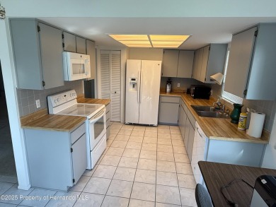 SPACIOUS & PRICED TO SELL 2/2/2 TIMBER PINES HOME ON CORNER LOT on Timber Pines Golf Course in Florida - for sale on GolfHomes.com, golf home, golf lot