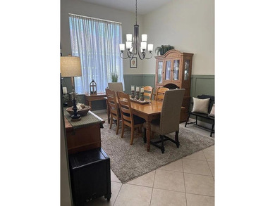 This exceptionally clean home features a newer 2023 heated on The Legacy Golf and Tennis Club in Florida - for sale on GolfHomes.com, golf home, golf lot