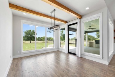 This exquisite custom residence within the great Hideout on Hideout Golf Club and Resort  in Texas - for sale on GolfHomes.com, golf home, golf lot