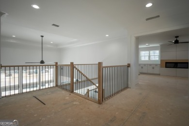 This gorgeous new construction is directly on Osprey Pointe Pond on Harbor Club Golf and Country Club in Georgia - for sale on GolfHomes.com, golf home, golf lot