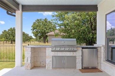This exquisite custom residence within the great Hideout on Hideout Golf Club and Resort  in Texas - for sale on GolfHomes.com, golf home, golf lot