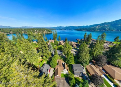 Cozy home with old-world charm coupled with modern conveniences on Hayden Lake Country Club in Idaho - for sale on GolfHomes.com, golf home, golf lot