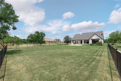 This exquisite custom residence within the great Hideout on Hideout Golf Club and Resort  in Texas - for sale on GolfHomes.com, golf home, golf lot
