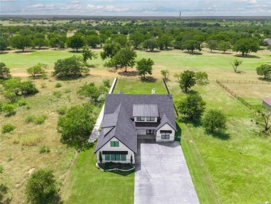 This exquisite custom residence within the great Hideout on Hideout Golf Club and Resort  in Texas - for sale on GolfHomes.com, golf home, golf lot