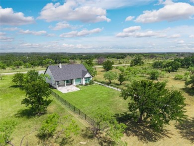 This exquisite custom residence within the great Hideout on Hideout Golf Club and Resort  in Texas - for sale on GolfHomes.com, golf home, golf lot