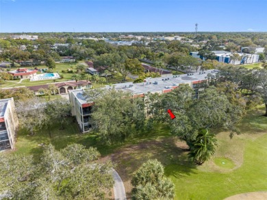 This First level condo will allow you to walk out to the on Largo Golf Course in Florida - for sale on GolfHomes.com, golf home, golf lot