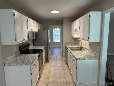 Welcome to this beautifully renovated 3-bedroom, 2-bathroom home on Hope Mills Golf and Country Club in North Carolina - for sale on GolfHomes.com, golf home, golf lot