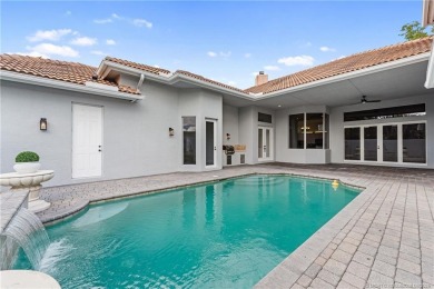 Welcome to your own private sanctuary-an elegant courtyard pool on The Cape Club of Palm City in Florida - for sale on GolfHomes.com, golf home, golf lot
