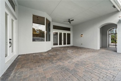 Welcome to your own private sanctuary-an elegant courtyard pool on The Cape Club of Palm City in Florida - for sale on GolfHomes.com, golf home, golf lot