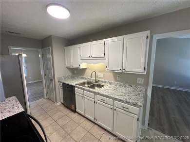 Welcome to this beautifully renovated 3-bedroom, 2-bathroom home on Hope Mills Golf and Country Club in North Carolina - for sale on GolfHomes.com, golf home, golf lot