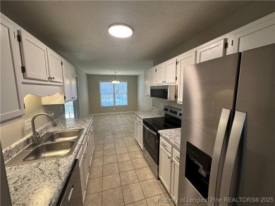 Welcome to this beautifully renovated 3-bedroom, 2-bathroom home on Hope Mills Golf and Country Club in North Carolina - for sale on GolfHomes.com, golf home, golf lot