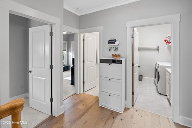 This stunning home in The Towns of St. James Plantation offers on Members Club At St. James Plantation in North Carolina - for sale on GolfHomes.com, golf home, golf lot