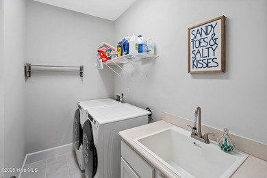 This stunning home in The Towns of St. James Plantation offers on Members Club At St. James Plantation in North Carolina - for sale on GolfHomes.com, golf home, golf lot