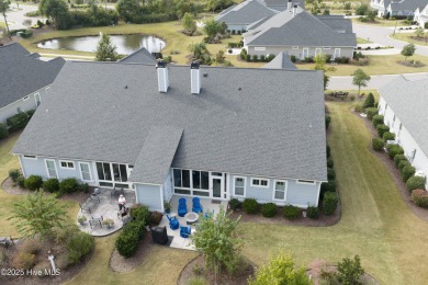 This stunning home in The Towns of St. James Plantation offers on Members Club At St. James Plantation in North Carolina - for sale on GolfHomes.com, golf home, golf lot