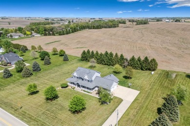 Step into timeless elegance with this stunning two-story on Dyersville Golf and Country Club in Iowa - for sale on GolfHomes.com, golf home, golf lot