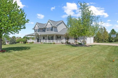 Step into timeless elegance with this stunning two-story on Dyersville Golf and Country Club in Iowa - for sale on GolfHomes.com, golf home, golf lot