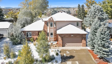 All-brick charmer on a cul-de-sac! This gorgeous home in the on The Olde Course At Loveland in Colorado - for sale on GolfHomes.com, golf home, golf lot