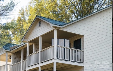 Great upper corner unit with no building next door. Located at on Rumbling Bald Resort on Lake Lure in North Carolina - for sale on GolfHomes.com, golf home, golf lot