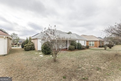 Step out your back door and play a round of golf as this 2BR/2BA on The International City Golf Course in Georgia - for sale on GolfHomes.com, golf home, golf lot