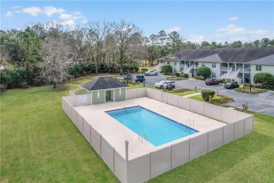 UPSTAIRS END UNIT OVERLOOKING SAPELO HAMMOCK GOLF COURSE WITH on Sapelo Hammock Golf Club in Georgia - for sale on GolfHomes.com, golf home, golf lot