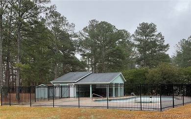 NEW PRICE/NEW PAINT AND CARPET/THIS HOME IS PRICED BELOW TAX on Carolina Trace Country Club in North Carolina - for sale on GolfHomes.com, golf home, golf lot