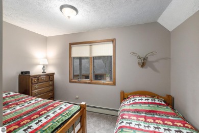 Pride of ownership shines throughout this original owner turnkey on Crystal Mountain Golf Course in Michigan - for sale on GolfHomes.com, golf home, golf lot