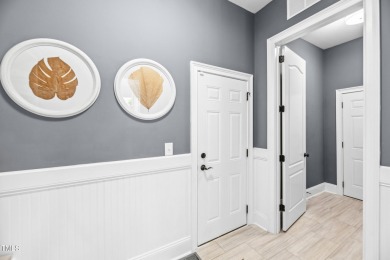 Welcome to this impeccably designed home in the sought-after on Hasentree Club in North Carolina - for sale on GolfHomes.com, golf home, golf lot
