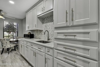 Discover this beautifully updated villa in the award-winning on Timber Pines Golf Course in Florida - for sale on GolfHomes.com, golf home, golf lot