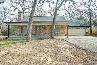 The property at 313 Comanche Drive in Lake Kiowa, Texas, is a on Lake Kiowa Golf Course in Texas - for sale on GolfHomes.com, golf home, golf lot