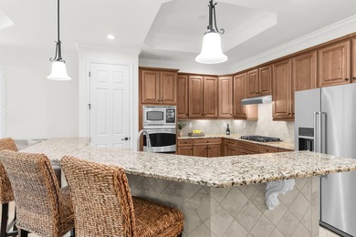 This open floor plan is light and bright with 2 bedrooms plus a on The Golf Club At Fiddlers Creek in Florida - for sale on GolfHomes.com, golf home, golf lot