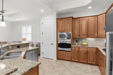 This open floor plan is light and bright with 2 bedrooms plus a on The Golf Club At Fiddlers Creek in Florida - for sale on GolfHomes.com, golf home, golf lot