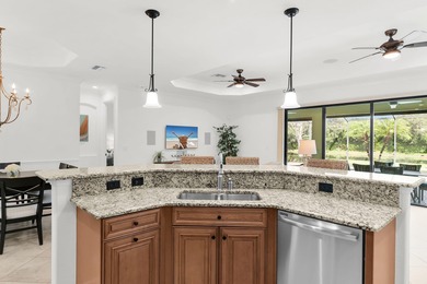 This open floor plan is light and bright with 2 bedrooms plus a on The Golf Club At Fiddlers Creek in Florida - for sale on GolfHomes.com, golf home, golf lot