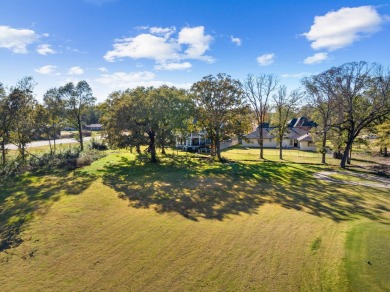 This beautiful home features wide porches and wrap-around on Idabel Country Club in Oklahoma - for sale on GolfHomes.com, golf home, golf lot