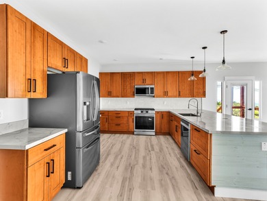 Enjoy expansive coastline and ocean views the moment you enter on Discovery Harbour Golf Course in Hawaii - for sale on GolfHomes.com, golf home, golf lot