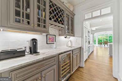 COMMANDING MASSIVE PALATIAL COLUMNS, THIS SUGARLOAF COUNTRY CLUB on TPC At Sugarloaf Golf Club in Georgia - for sale on GolfHomes.com, golf home, golf lot