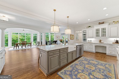 COMMANDING MASSIVE PALATIAL COLUMNS, THIS SUGARLOAF COUNTRY CLUB on TPC At Sugarloaf Golf Club in Georgia - for sale on GolfHomes.com, golf home, golf lot