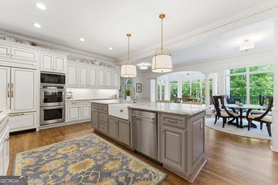 COMMANDING MASSIVE PALATIAL COLUMNS, THIS SUGARLOAF COUNTRY CLUB on TPC At Sugarloaf Golf Club in Georgia - for sale on GolfHomes.com, golf home, golf lot